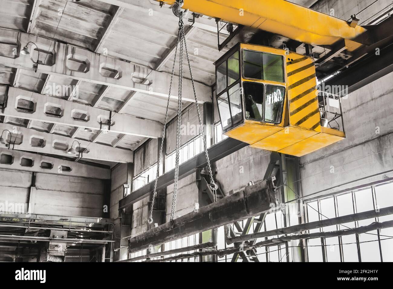Overhead crane hoist equipment in an industrial plant transports an