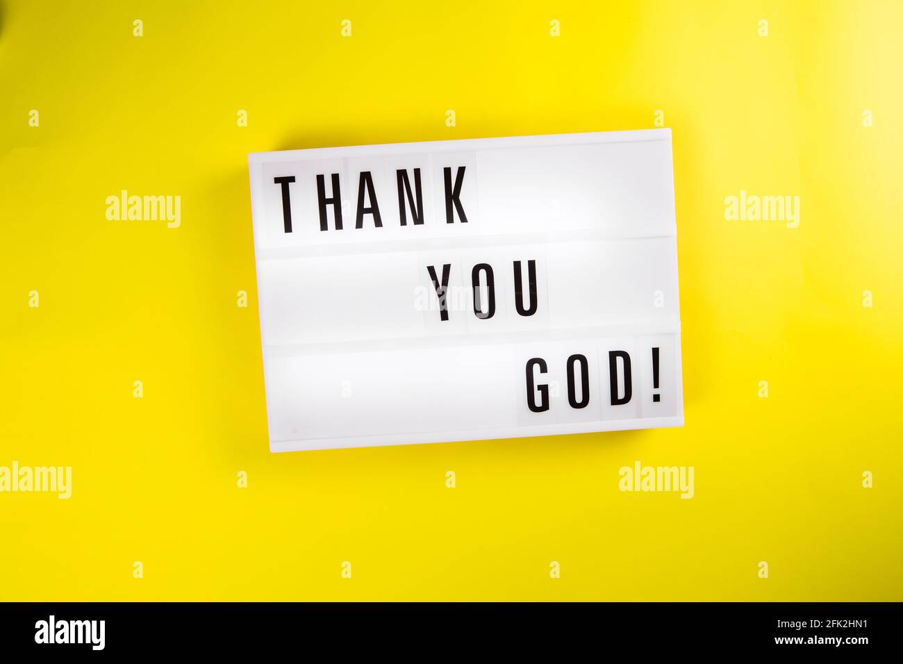 Lightbox with message THANK YOU GOD on yellow background, pleased gratefulness Stock Photo