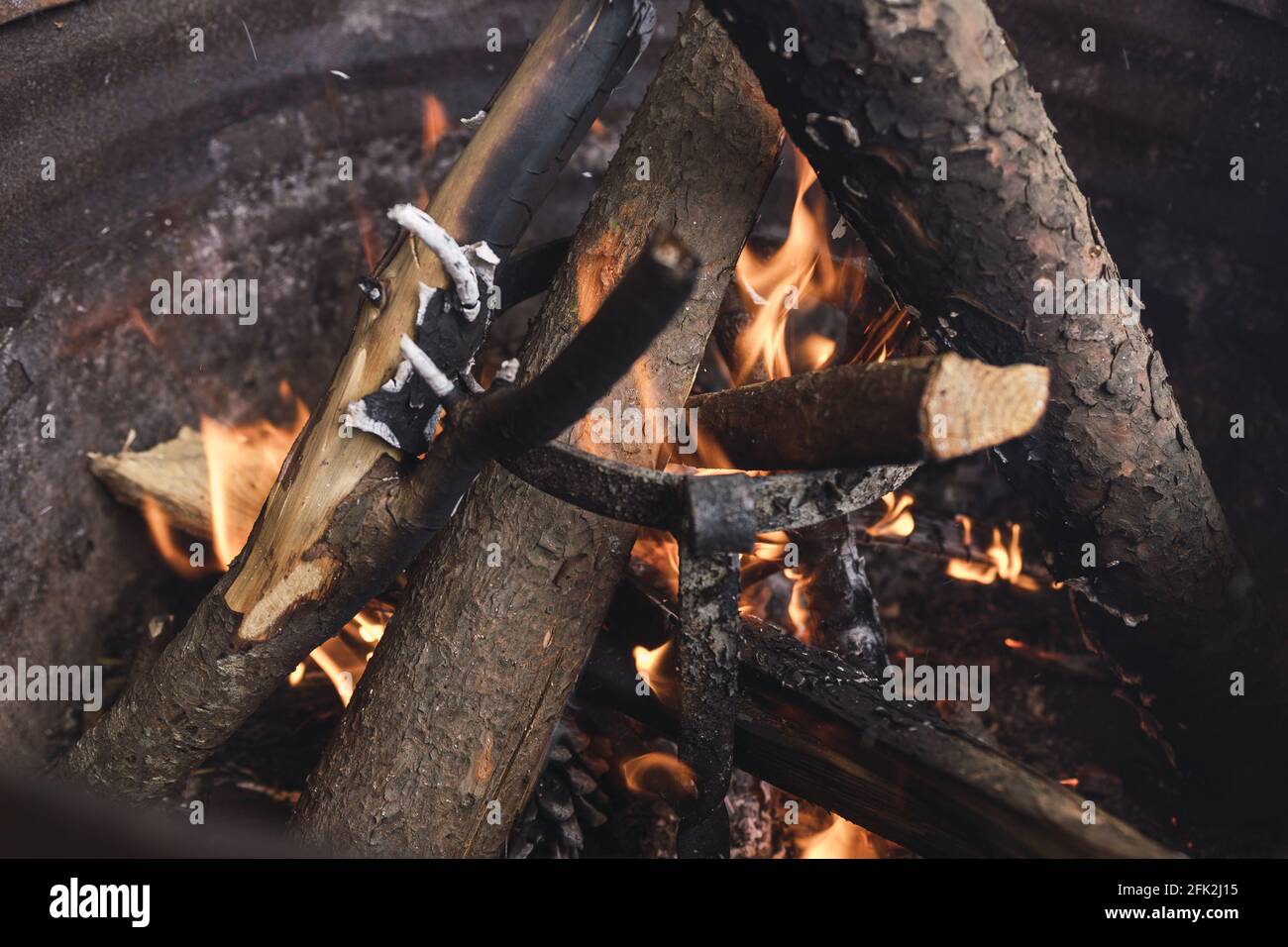 Closeup shot of a burning fire with wood Stock Photo - Alamy