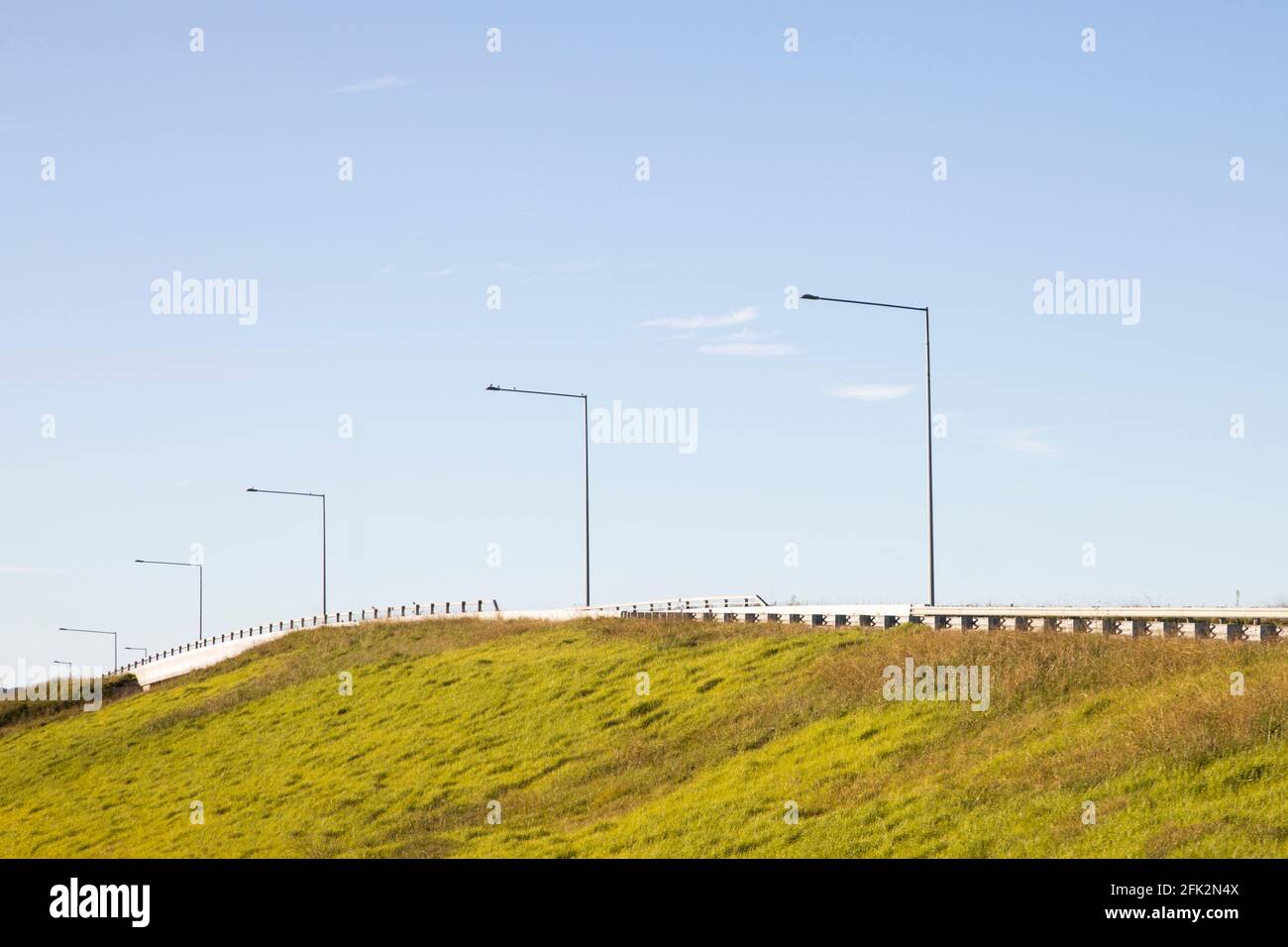 Rural interstate infrastructure highway change over with pylons. Stock Photo