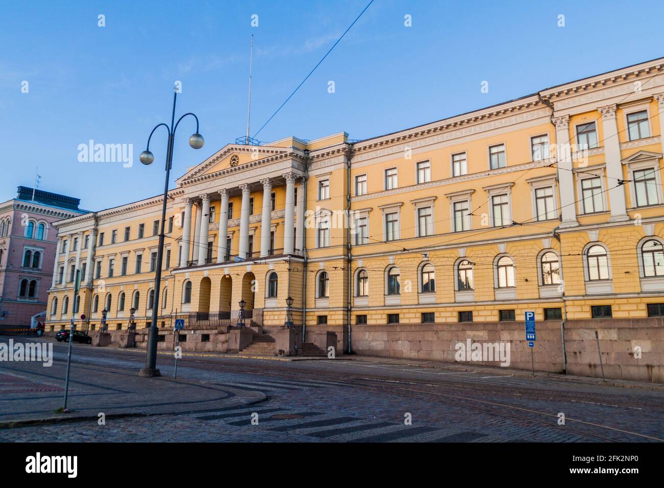 Yellow colored columned Government Palace on the Senate Square in Helsinki Stock Photo