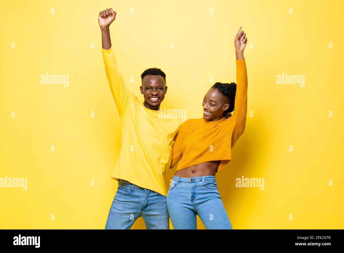 Happy fun smiling young African American couple holding each other and ...