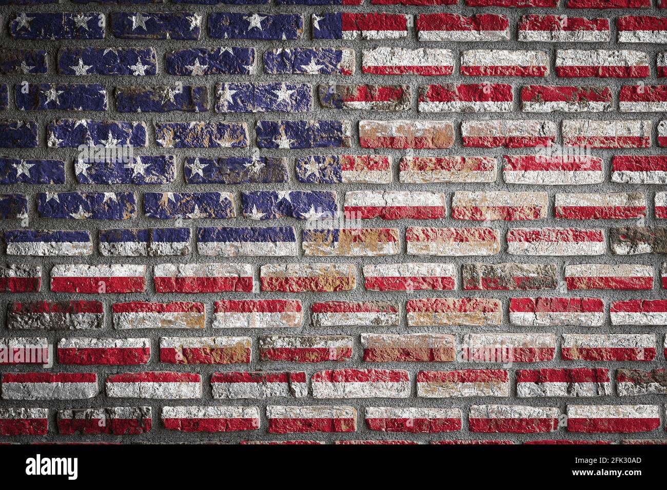 National flag of USA depicting in paint colors on an old brick wall ...