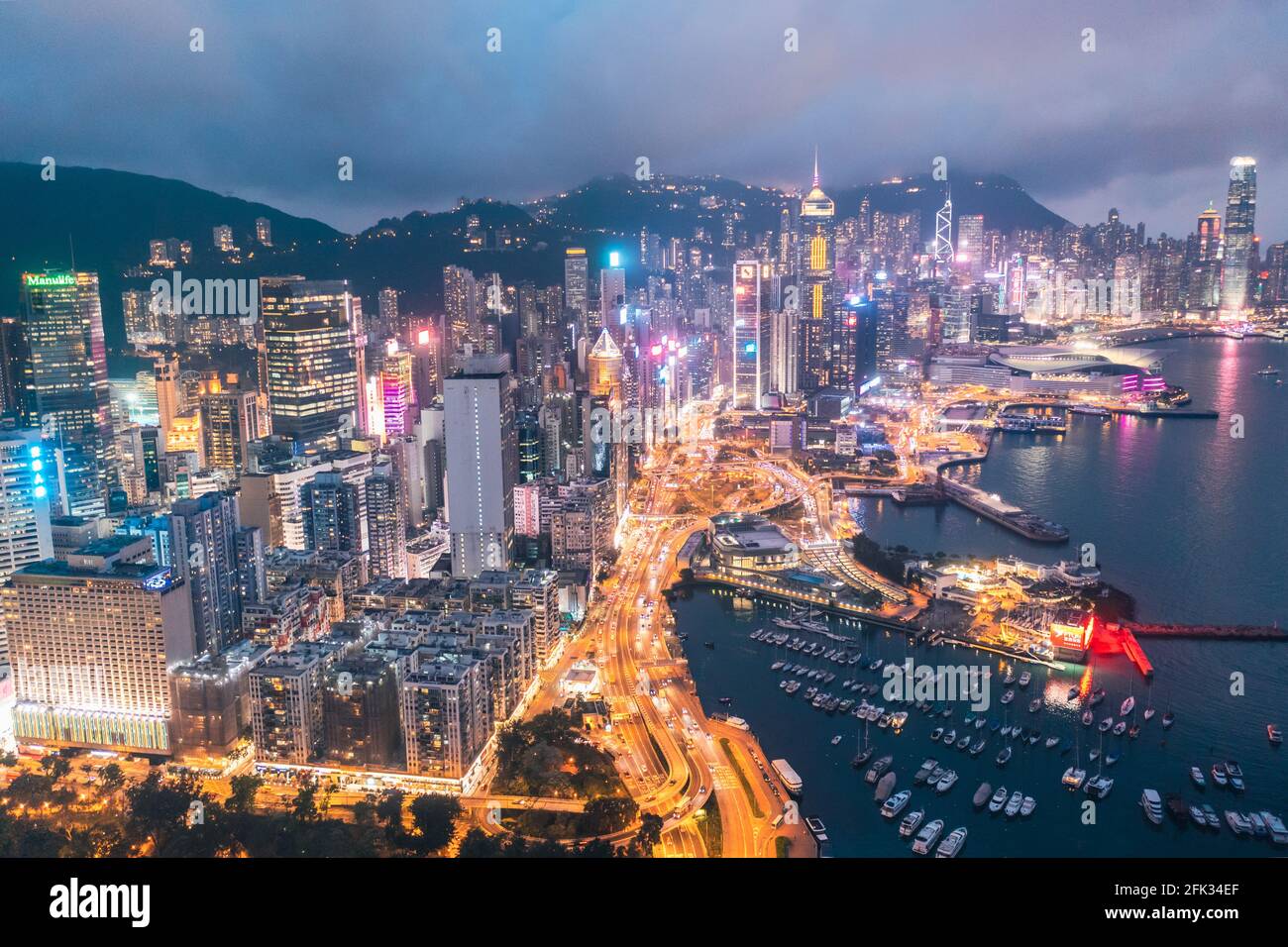 Epic aerial view of night scene of Victoria Harbour, Hong Kong, famous