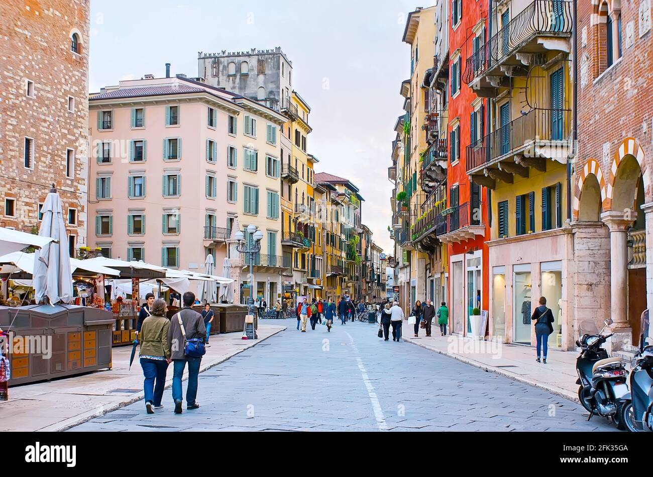 VERONA, ITALY - APRIL 23, 2012: The view of the colorful houses of Via Cappello street from the Piazza Erbe Square, on April 23 in Verona Stock Photo