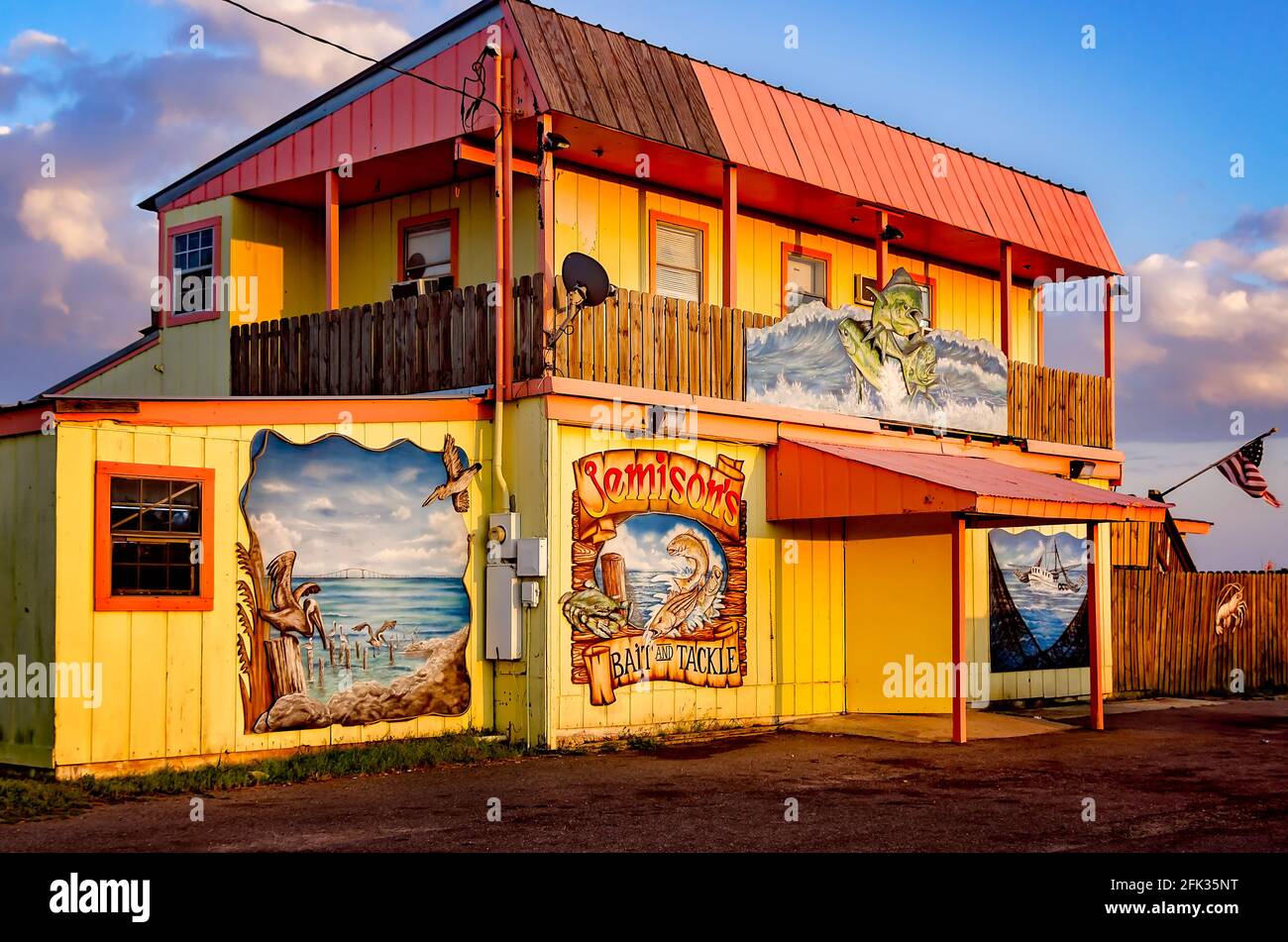 The sun sets on Jemison's Bait and Tackle bait shop, April 27, 2021, in  Coden, Alabama. The bait shop opened in the 1940s Stock Photo - Alamy