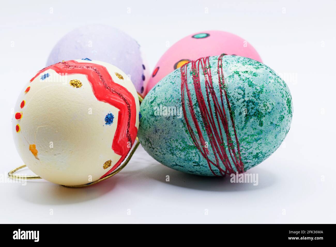 four hand-painted Easter eggs on white background Stock Photo