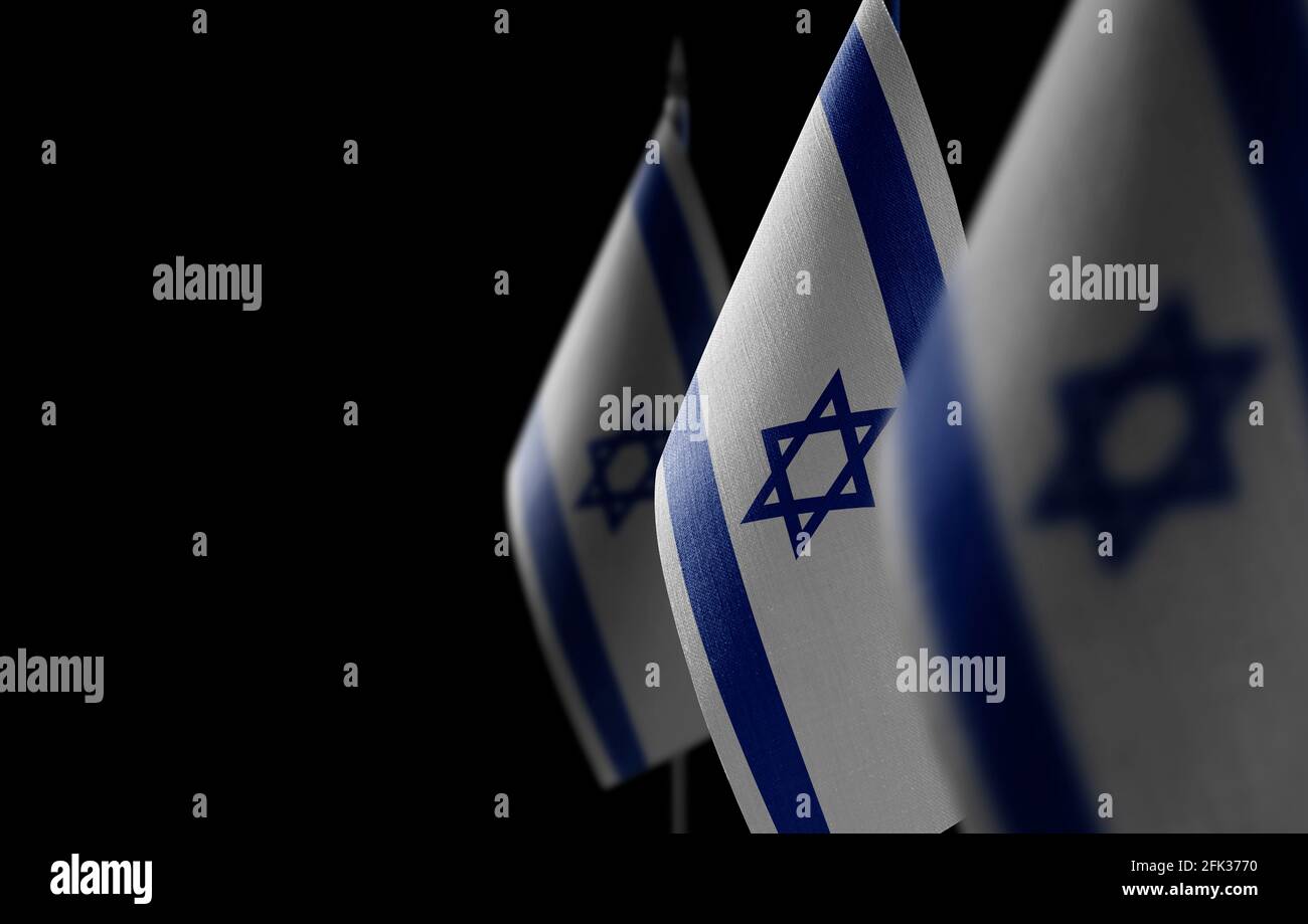 Small national flags of the Israel on a black background Stock Photo
