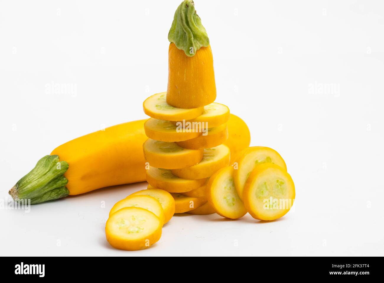 Whole And Sliced Pieces Of Summer Squash Zucchini, Yellow Colored Gourd Also Known As Courgette, Baby Marrow, Indian Jugni Sabzi Or Jugnu Petha Sabji Stock Photo
