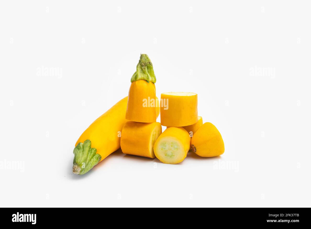 Whole And Sliced Pieces Of Summer Squash Zucchini, Yellow Colored Gourd Also Known As Courgette, Baby Marrow, Indian Jugni Sabzi Or Jugnu Petha Sabji Stock Photo