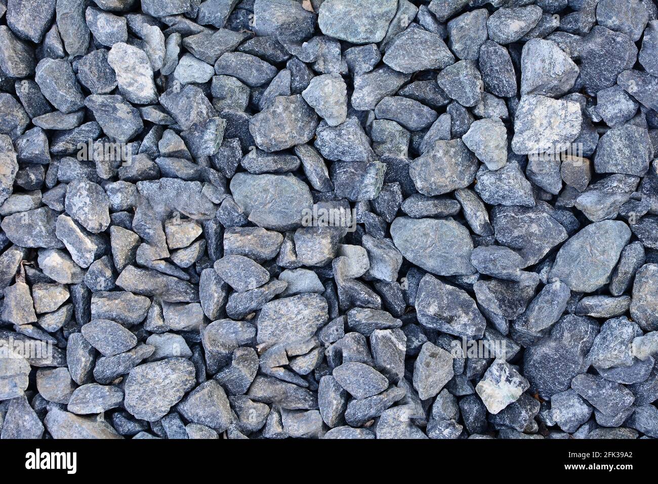 Background of gray gravel. Full frame gray gravel texture and pattern. Stock Photo