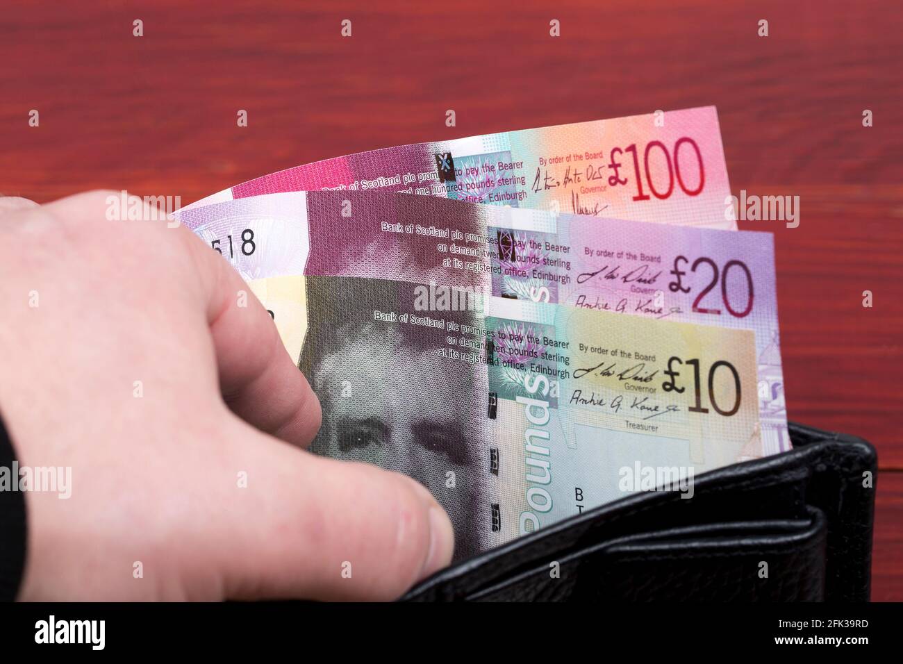 Scottish money - Pounds in a black wallet Stock Photo