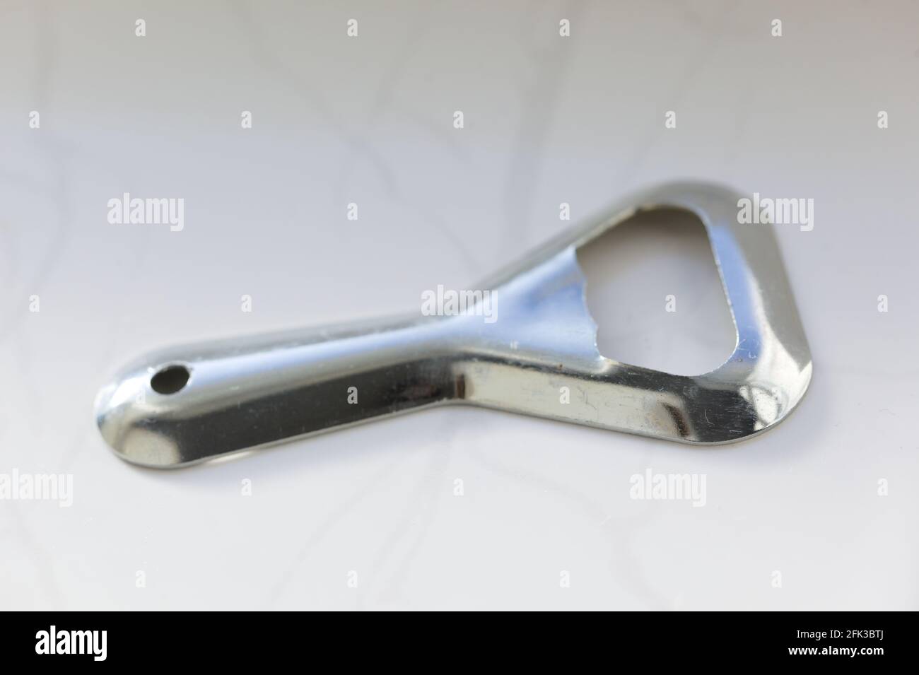 Close-up of an old metal bottle opener Stock Photo