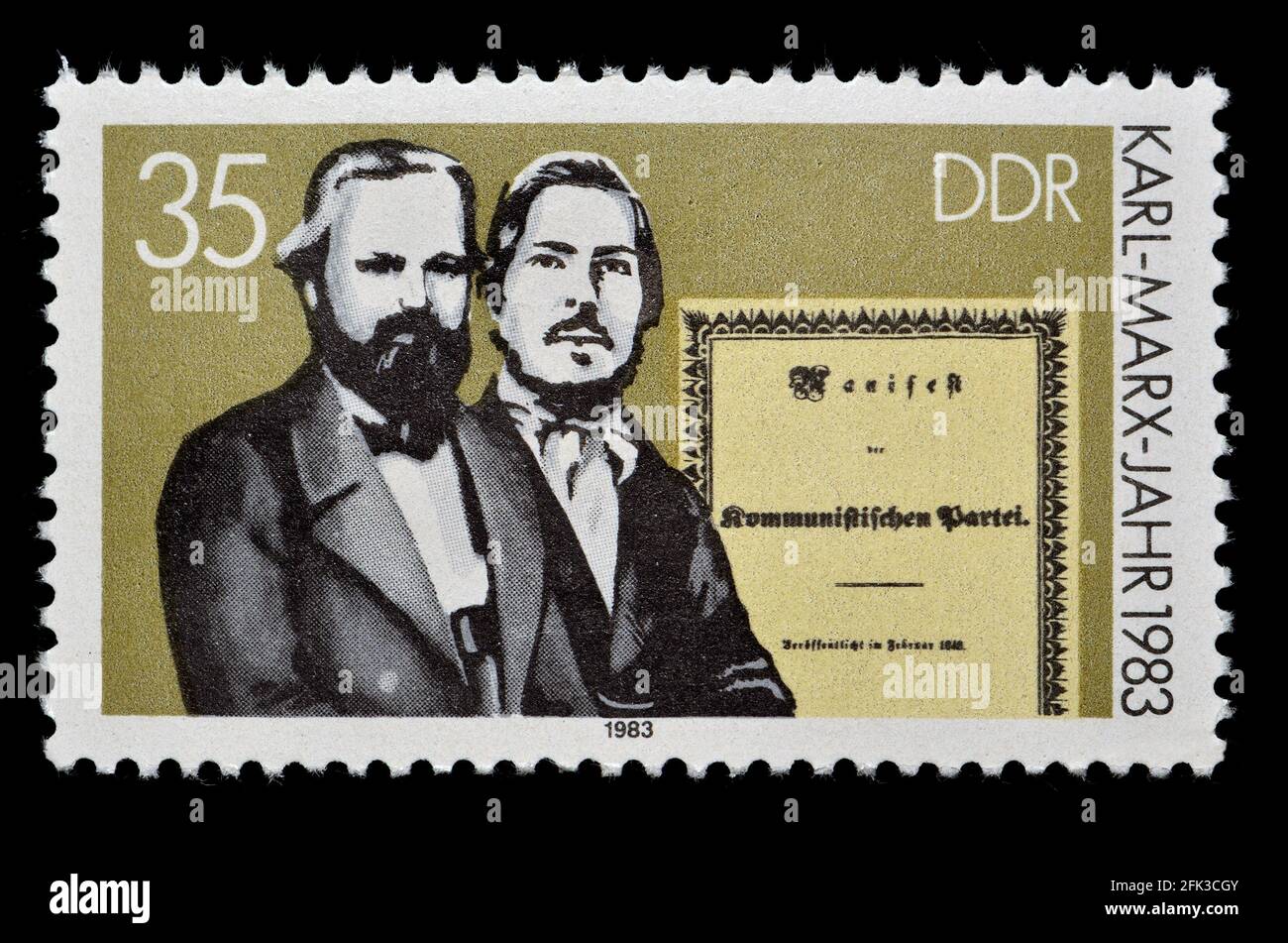 East German postage stamp (1983) : Karl Marx Jahr / Year 1983. Karl Marx and Friedrich Engels with the Communist Manifesto Stock Photo