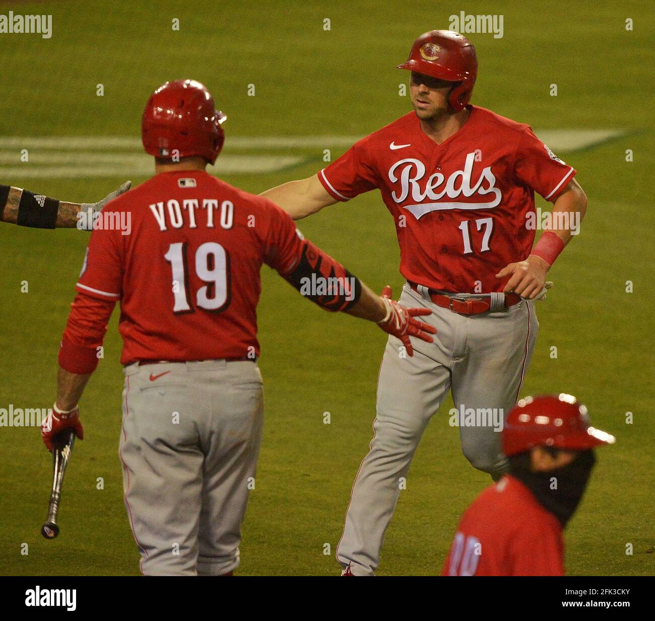 Los Angeles, Unites States. 28th Apr, 2021. Cincinnati Reds' Kyle Farmer  (17) celebrates with teammate Joey Votto (19) after tying the game 3-3 on  the RBI single by Jesse Winker in the