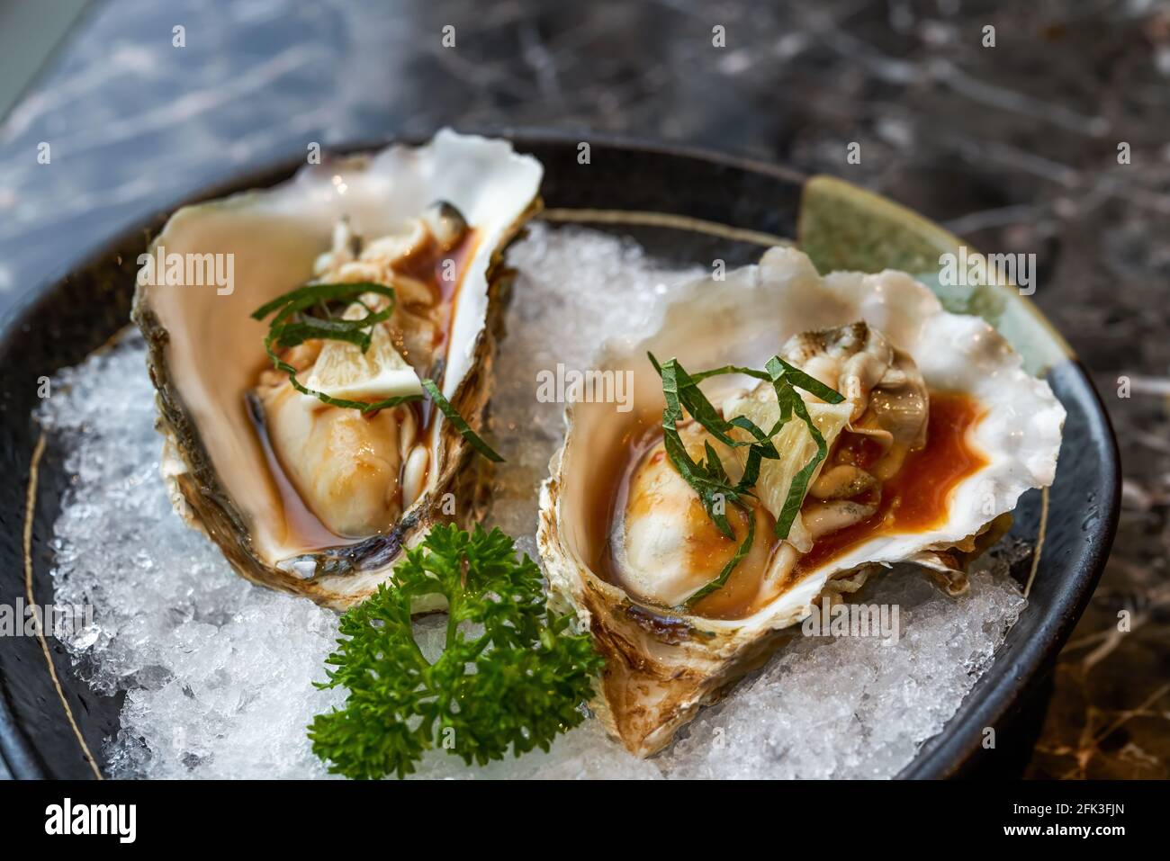 A delicious Japanese dish, oyster sashimi Stock Photo Alamy