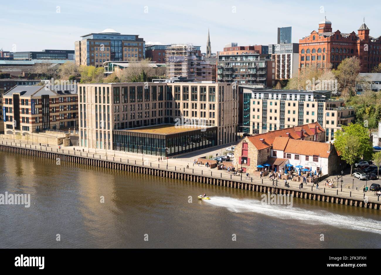 A jet ski passes by Wetherspoons pub and the Innside hotel on Newcastle
