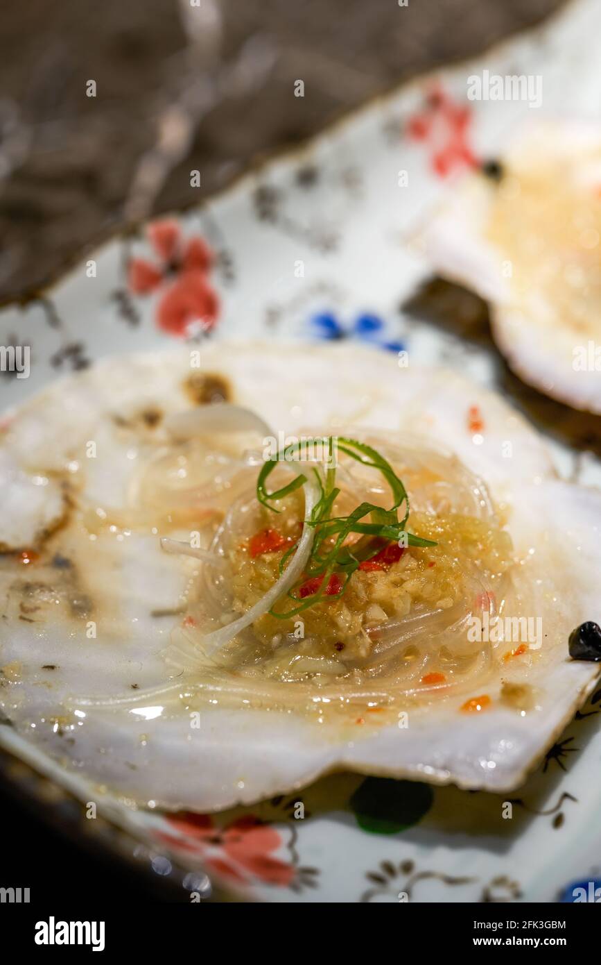 A delicious Japanese dish, raw grilled scallops Stock Photo Alamy