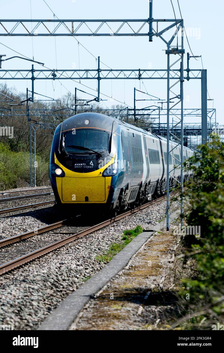 Avanti West Coast Pendolino electric train at speed, Easenhall