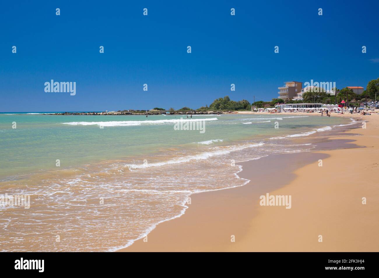 Realmonte, Agrigento, Sicily, Italy. View across bay from sandy beach, gentle waves lapping shore. Stock Photo