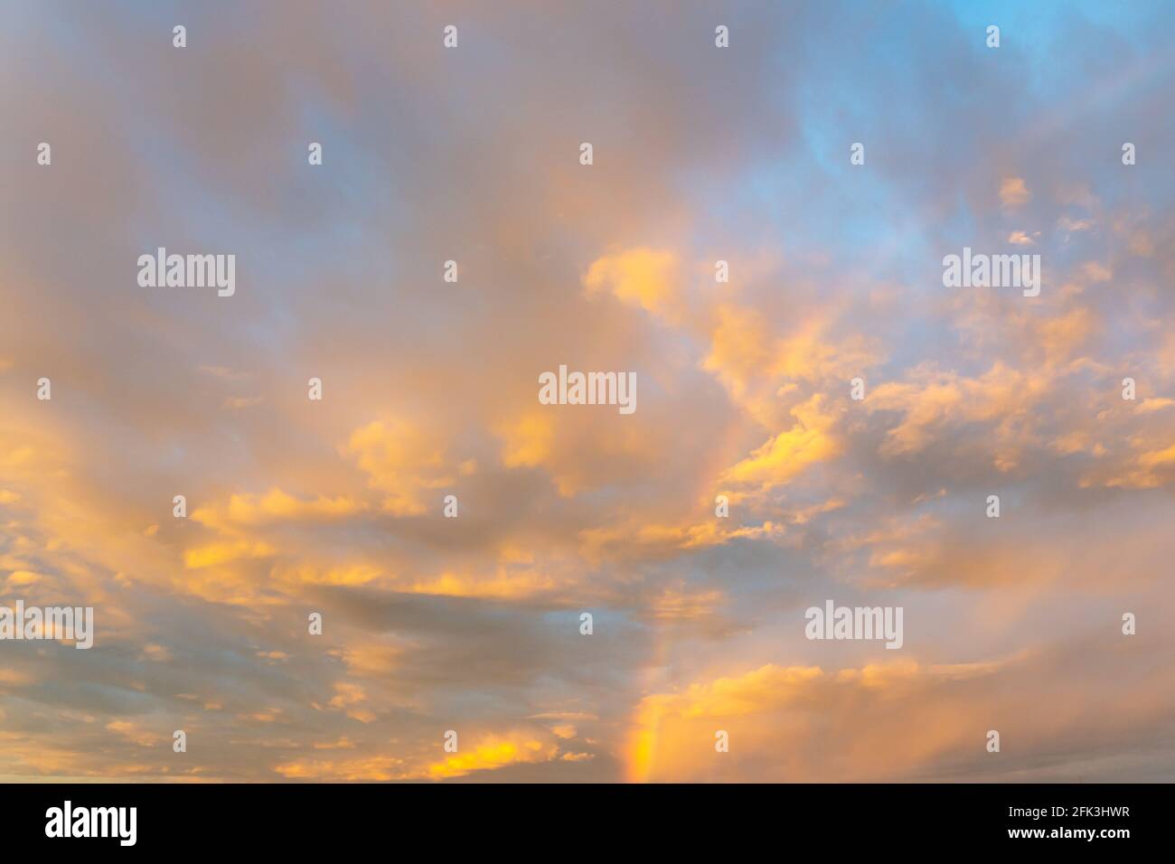 Rainbow in cumulus clouds hi-res stock photography and images - Alamy