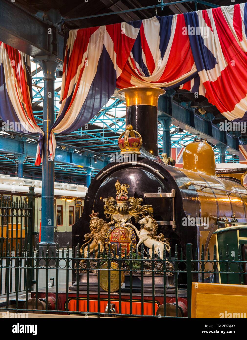 York, North Yorkshire, England. 1882 LB&SCR B1 Class steam locomotive, Gladstone, on display beneath Union Jacks at the National Railway Museum. Stock Photo