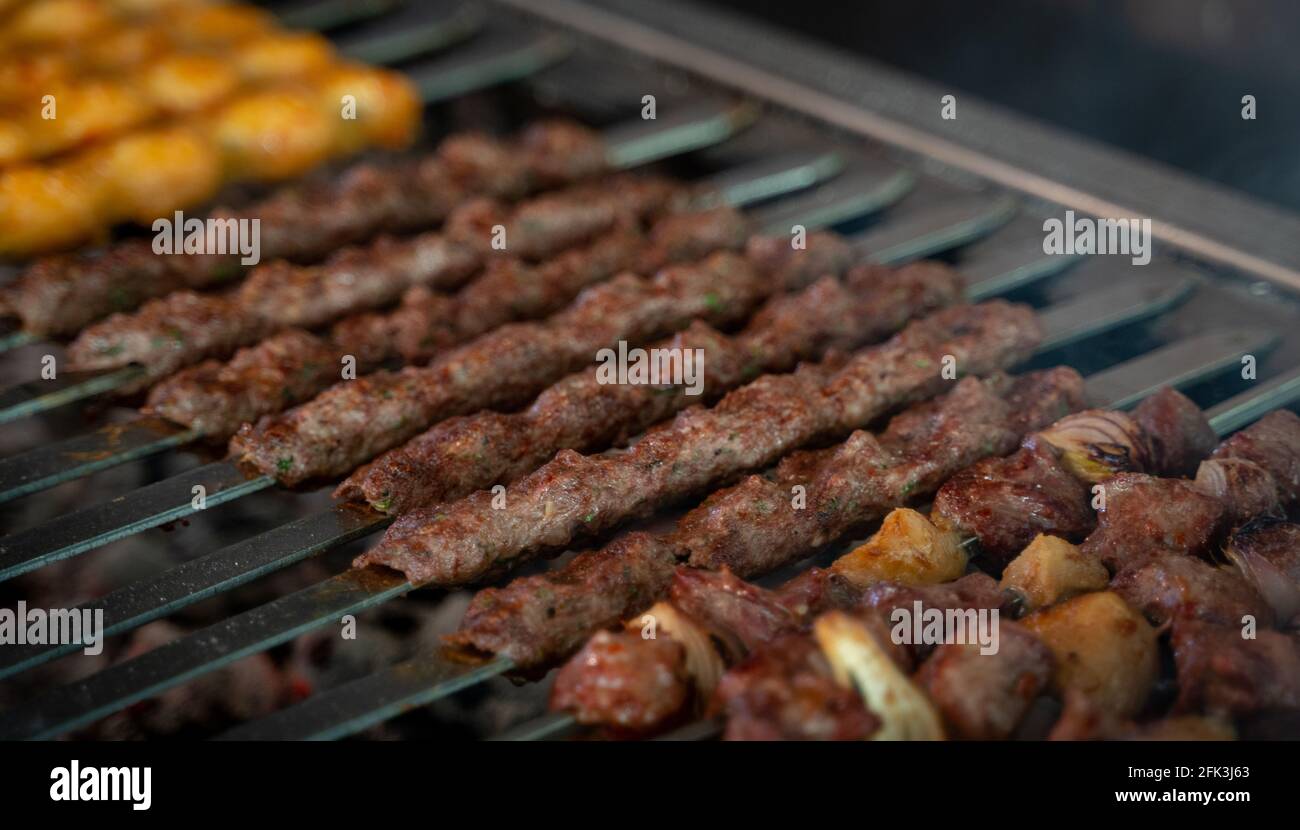 Arabic traditional food kufta and lamb brochette on the grill Stock Photo -  Alamy