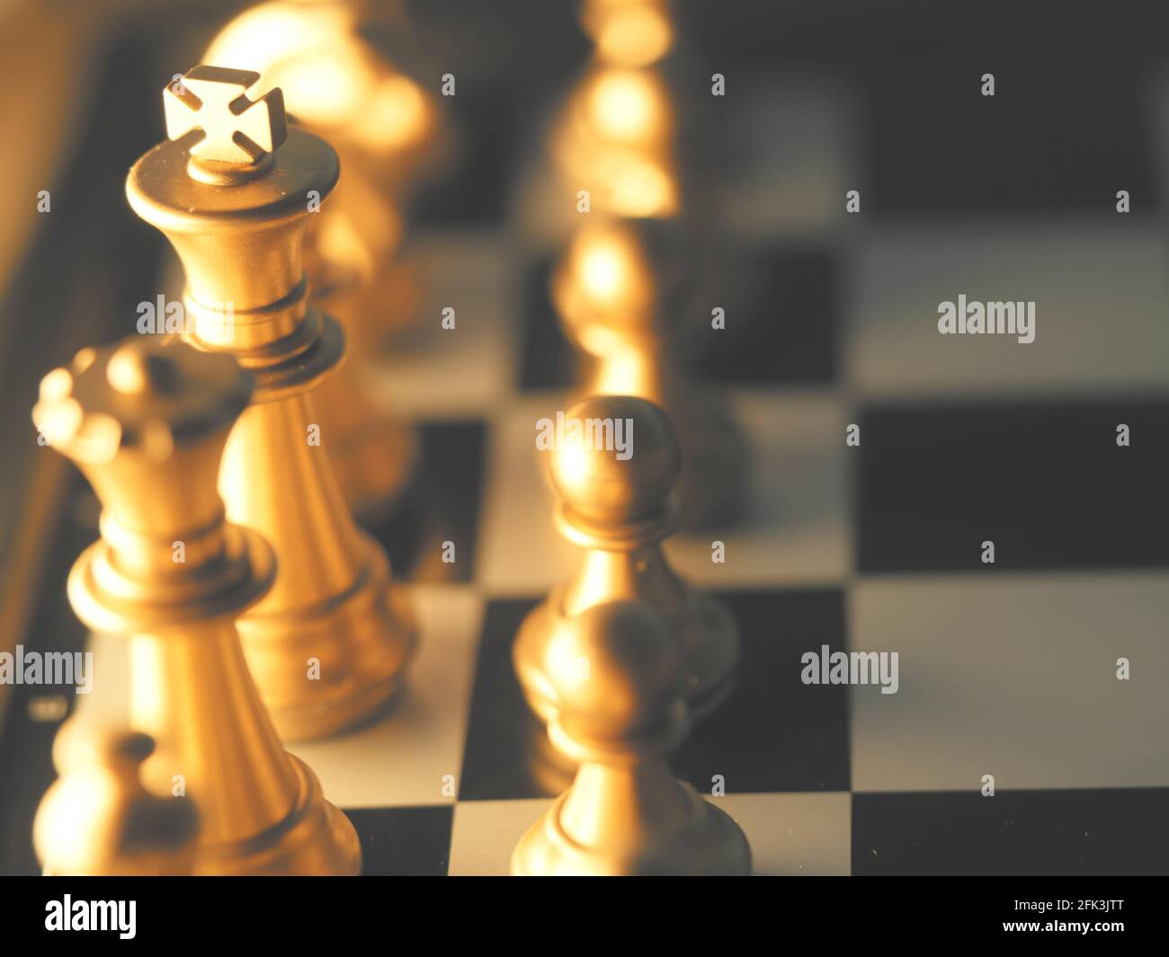 Chess pieces on a chessboard - Focus on the King Stock Photo - Alamy