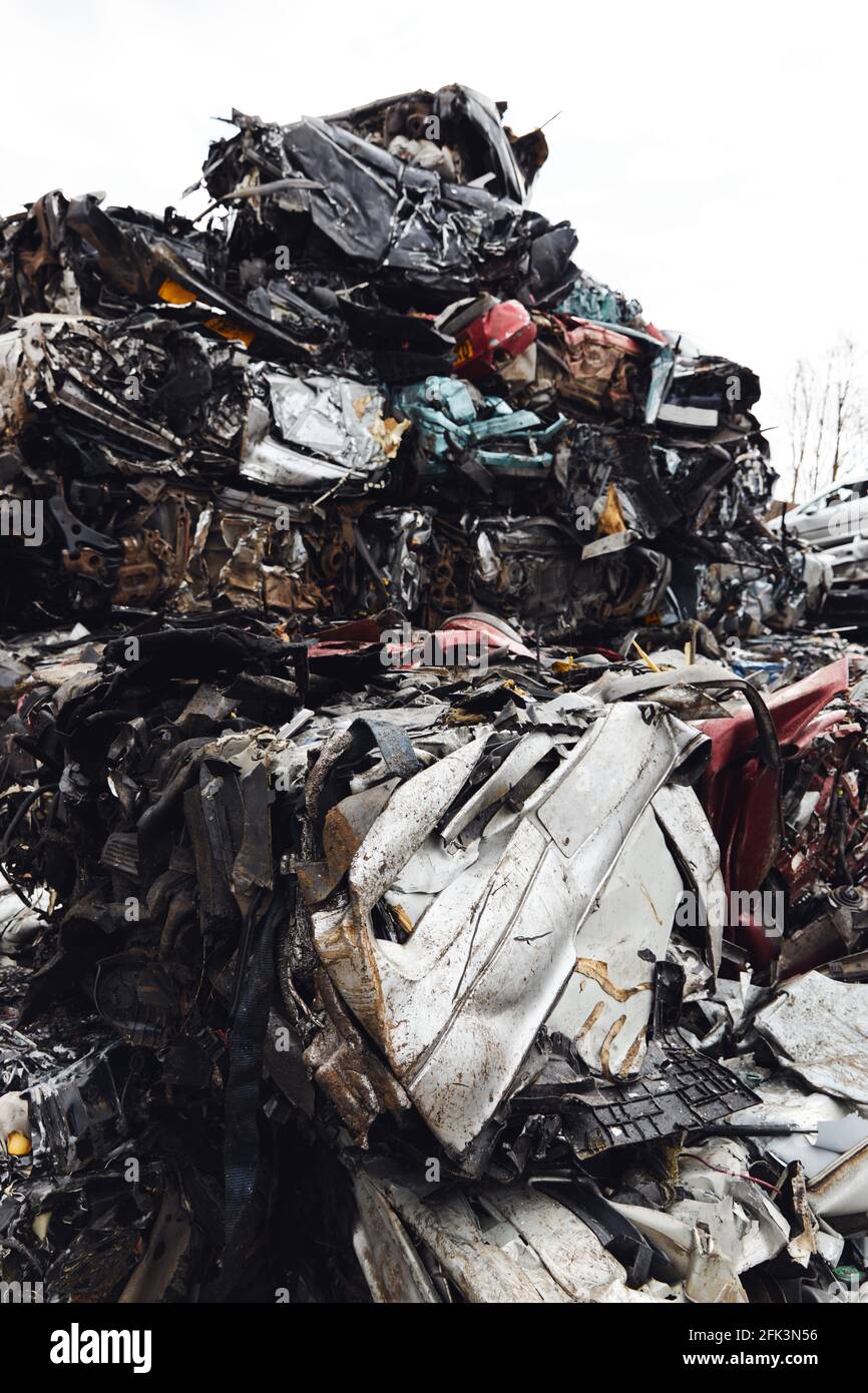 Scrapped cars crushed in vehicle recycling centre Stock Photo - Alamy