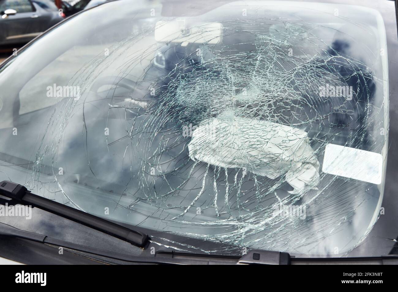 Close up of smashed windscreen on vandalised car Stock Photo
