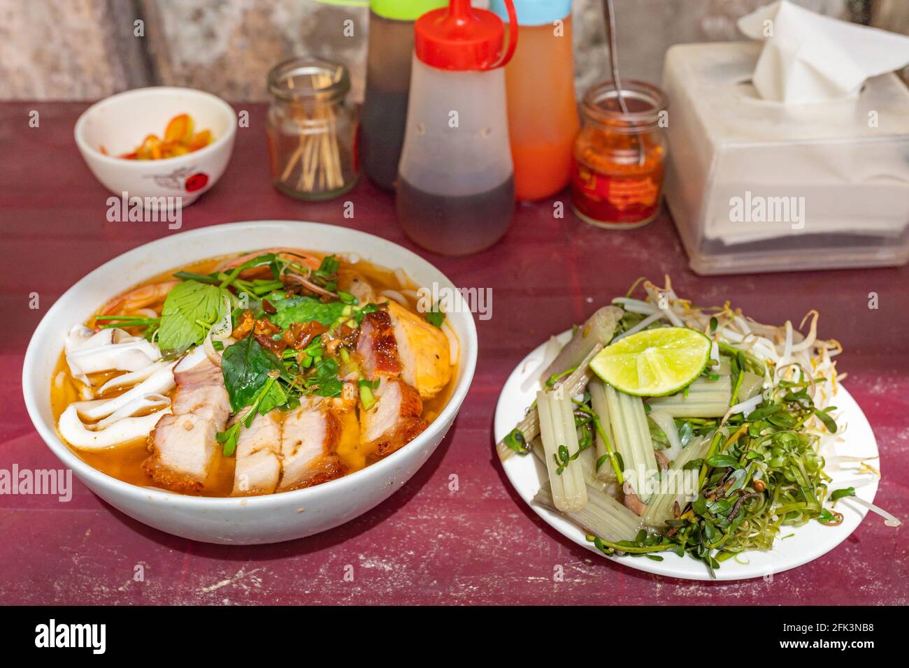 Bowl of delicious Vietnamese seafood noodles soup - Bun Mam Stock Photo