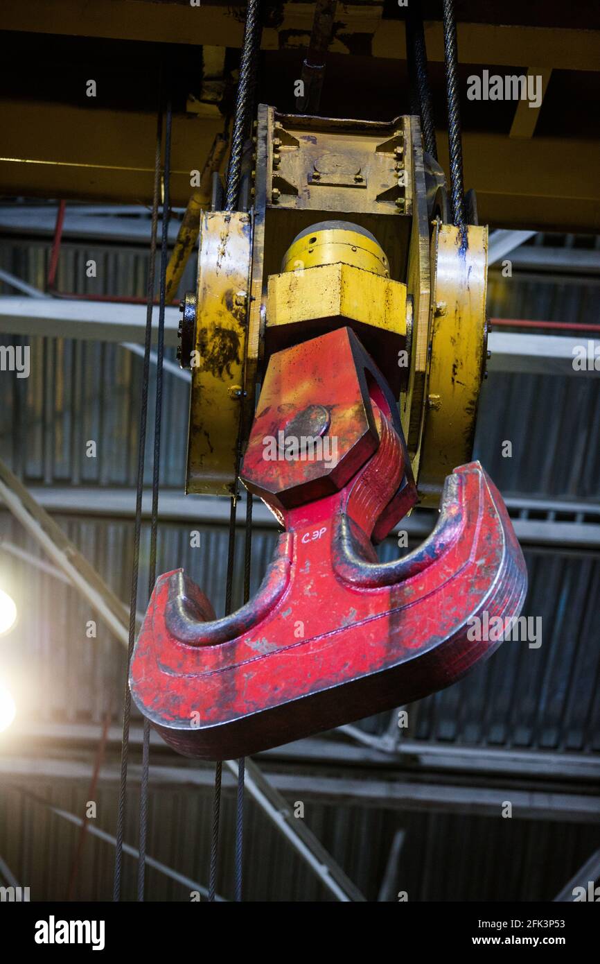 Abstact industrial background. Close-up photo of overhead crane hook. On factory or plant. Stock Photo