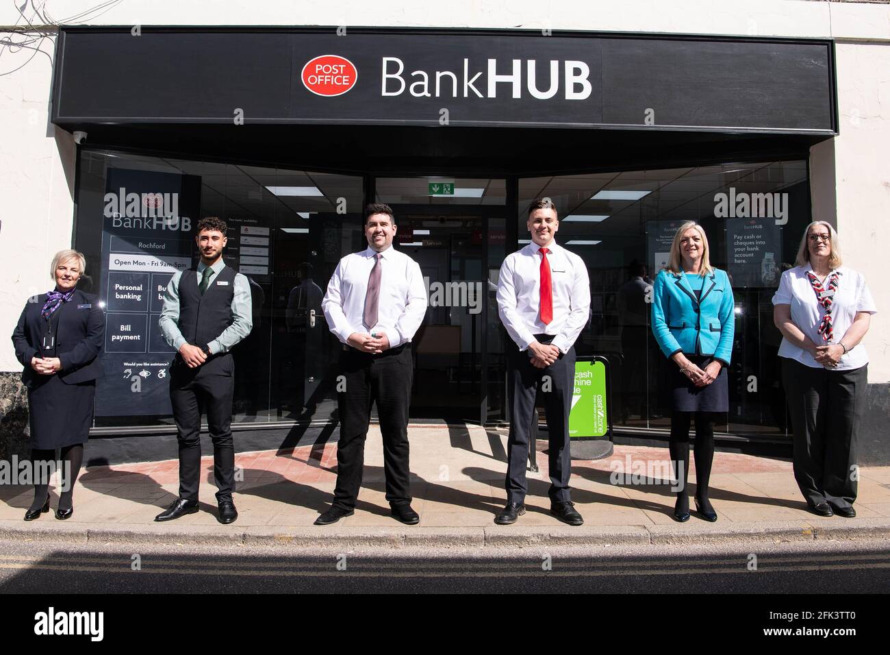 EDITORIAL USE ONLY (Left to right) Toni Jean Bapiste, NatWest Community Banker, David Szczapaniak, Lloyds Bank Community Banker, Richard Fleetwood, Post Office Postmaster, Fred Easlea, Santander Community Banker, Lisa Burton, Barclays Community Banker, Alison Dawn Hoskin, HSBC Community Banker at the launch of the Post Office BankHub in Rochford, as the high street no longer has a bank, the service will provide locals with basic banking and cash services, as well as dedicated rooms where customers can speak to community bankers from their own bank. Issue date: Wednesday April 28, 2021. Stock Photo