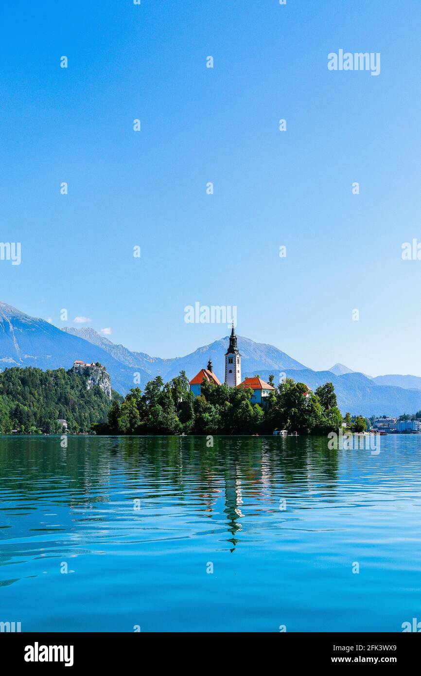 Vertical shot of Lake Bled and Bled Castle in Krajna, Slovenia Stock Photo
