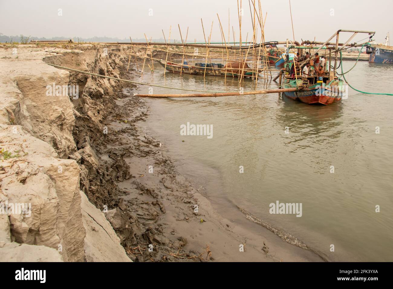 Massive erosion of the riverbank. I captured this image on 12-02-2021 from Bangladesh, South Asia Stock Photo
