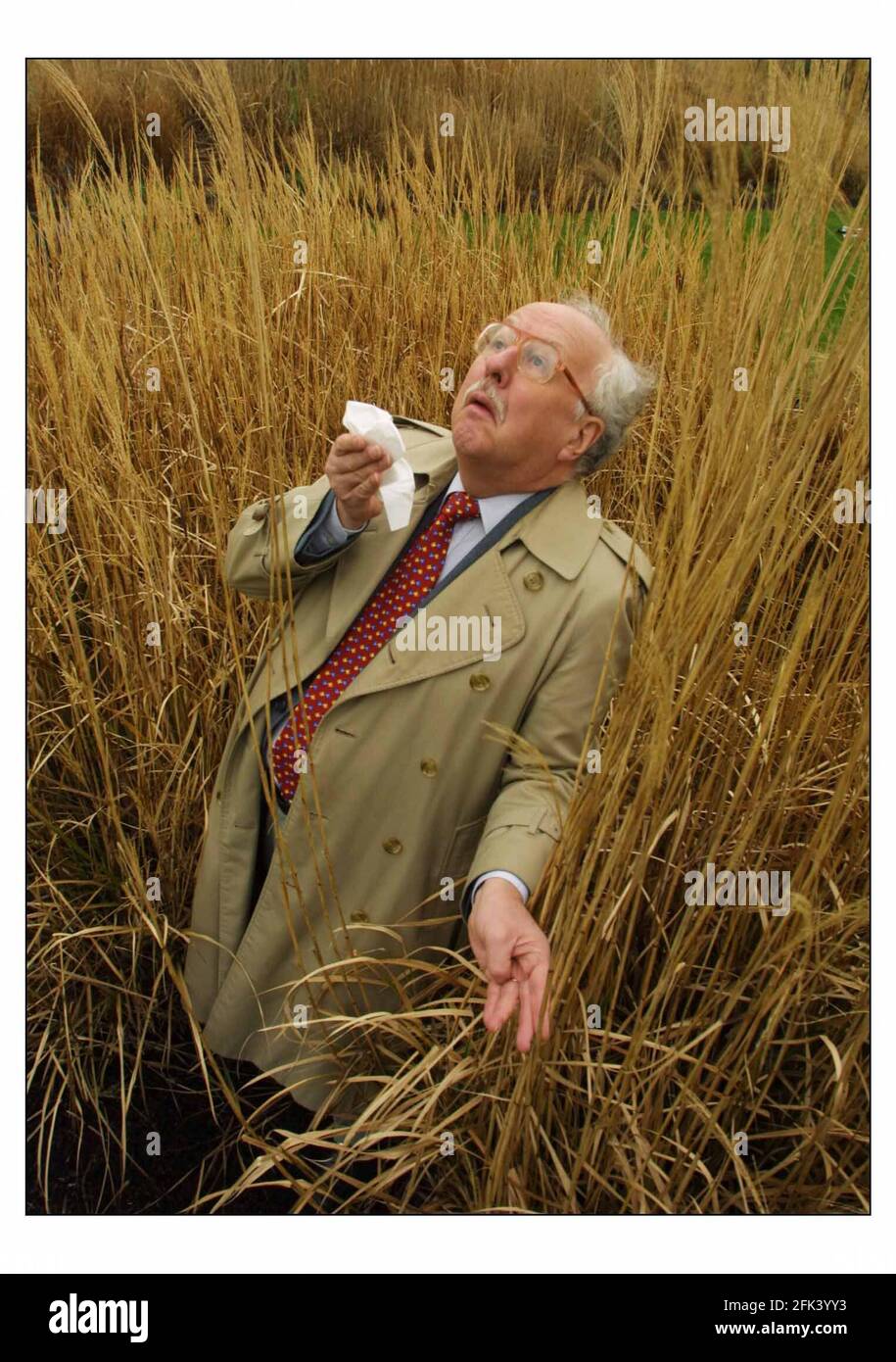 The Weatherman Michael Fish, a hayfeaver sufferer, is helping The Woodland Trust monitor the emergence of grasspollen at Kew Gardens. Climate change means grass is releasing pollen earlier which is bad for hayfeaver sufferers.pic David Sandison 12/2/2003 Stock Photo