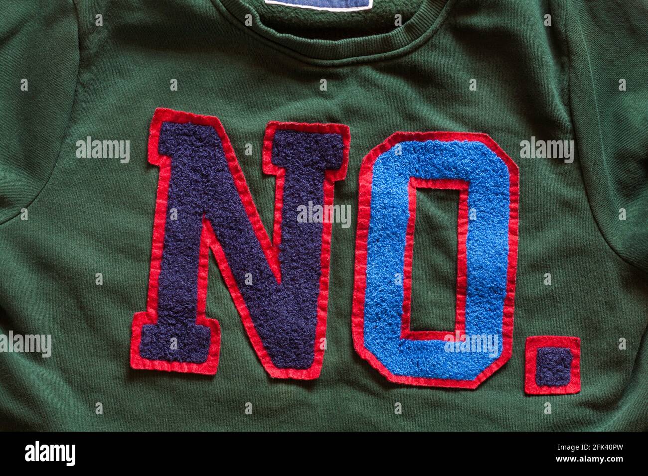 No - detail on front of boys green sweatshirt  - TU original apparel Stock Photo