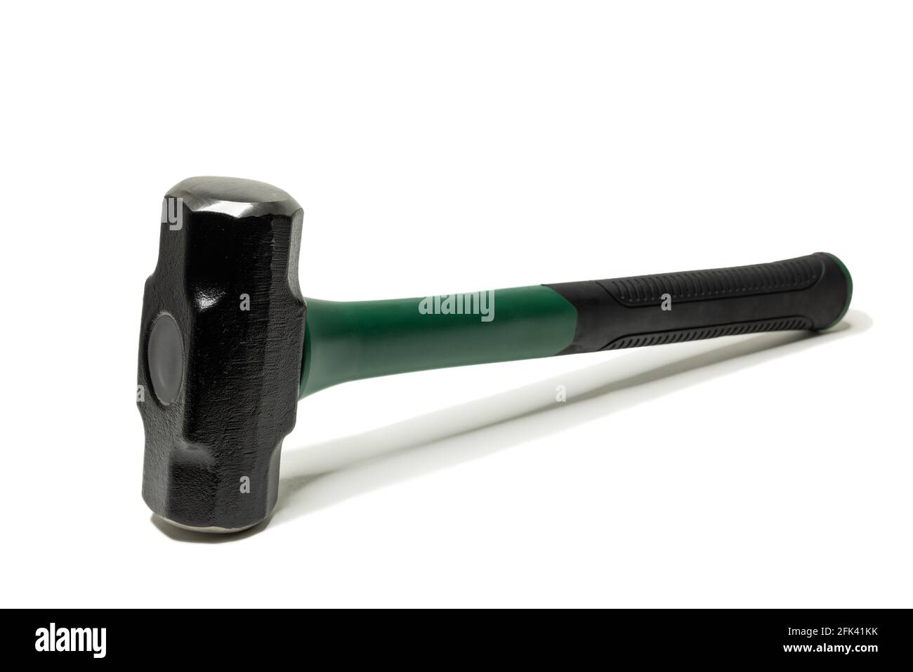 Sledgehammer with a green and black handle. Stock Photo