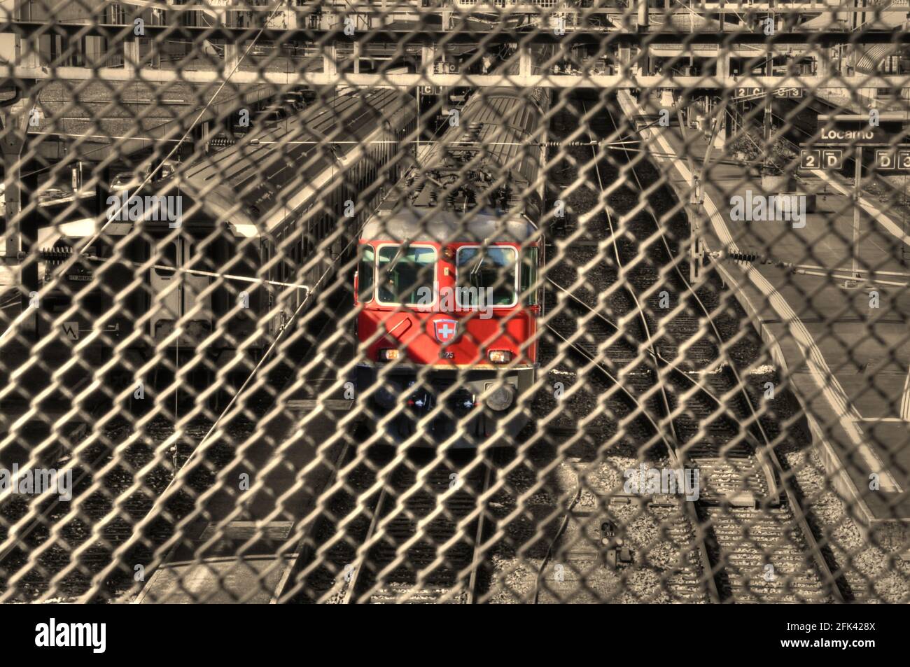 Grated R Train Red Train Behind a Metal Grate in Locarno, Ticino in Switzerland Stock ...