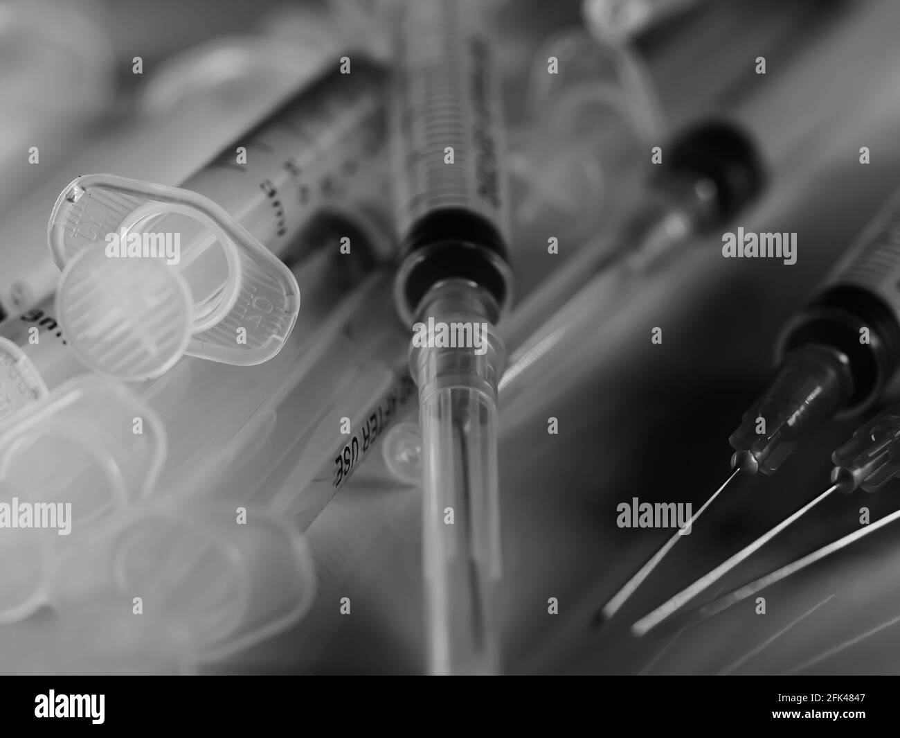 Several syringe on white table prepared for injection in hospital, selective focus, DOF, macro Stock Photo