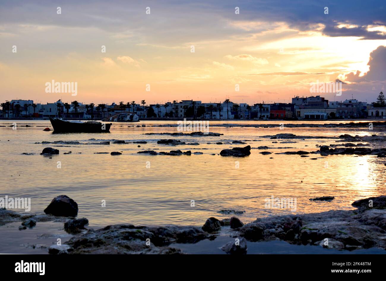 Sunset by the harbour in Salento, Italy Stock Photo