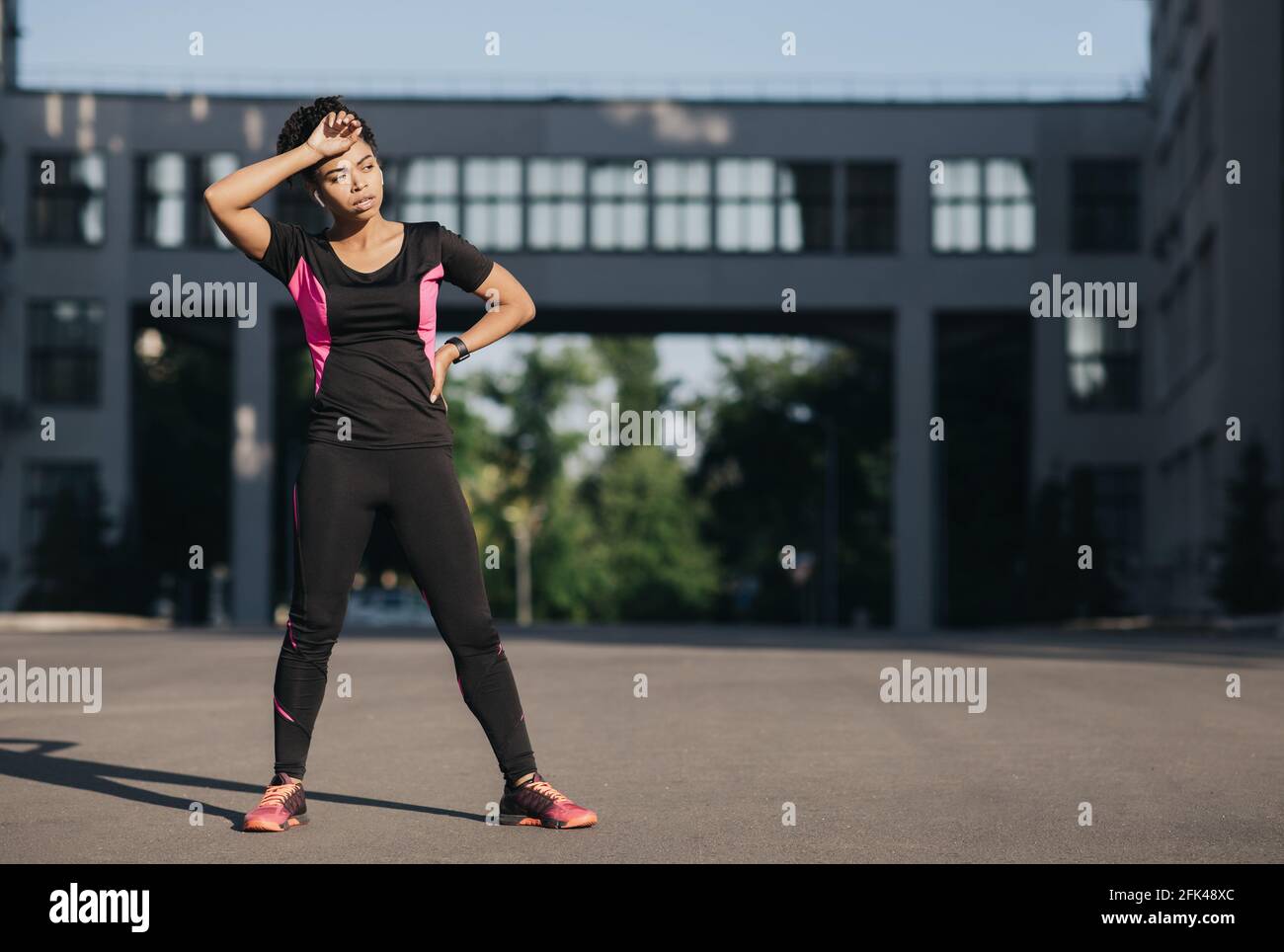 Jogging for beginner, hard training and respite, sport outdoor, urban fitness and workout on street Stock Photo