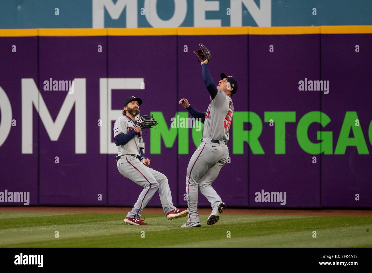 Minnesota Twins right fielder Brent Rooker reaches up to catch the ball during an MLB regular season game against the Cleveland Indians, Monday, April Stock Photo