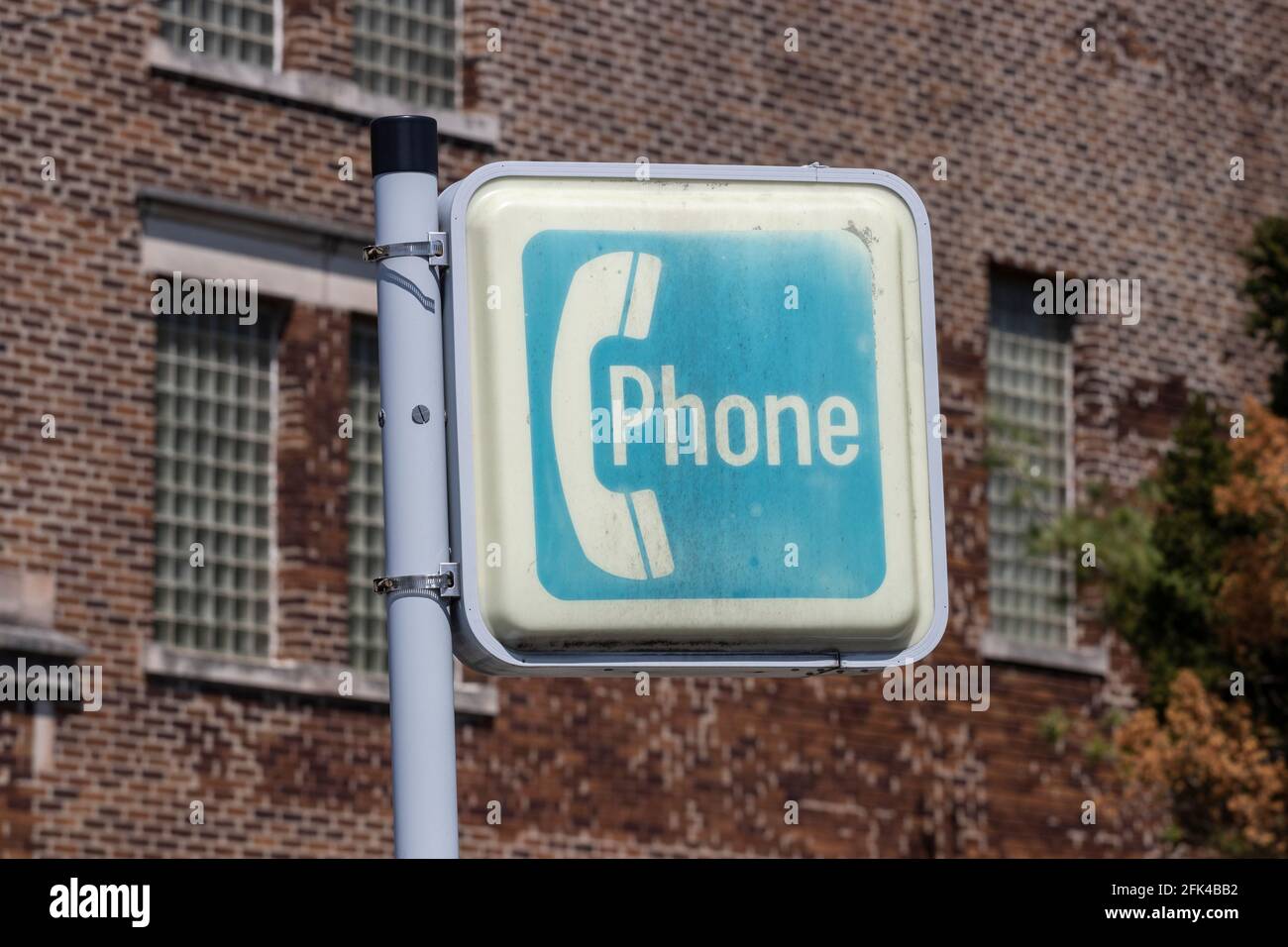 Sign for an ancient pay phone. Before cell phones in the 20th and early