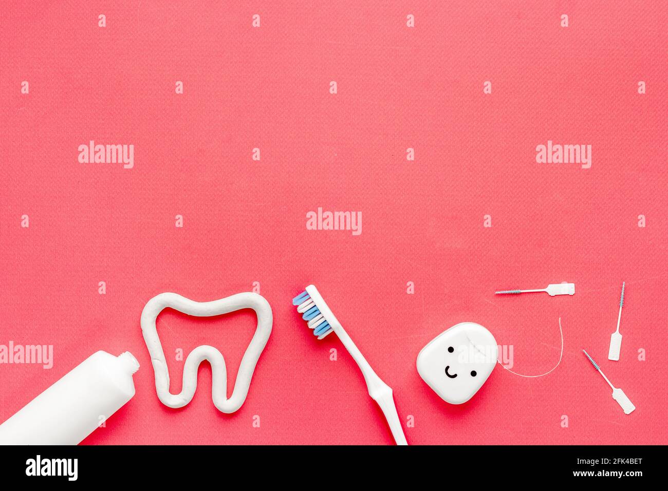 Toothbrush with tube of toothpaste and dental floss. Oral care and ...