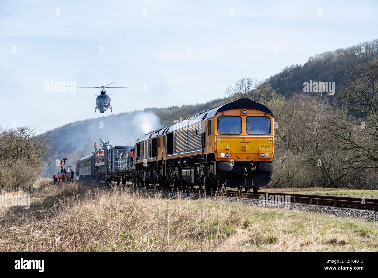 A helicopter filming Tom Cruise fighting on top of a train for Mission