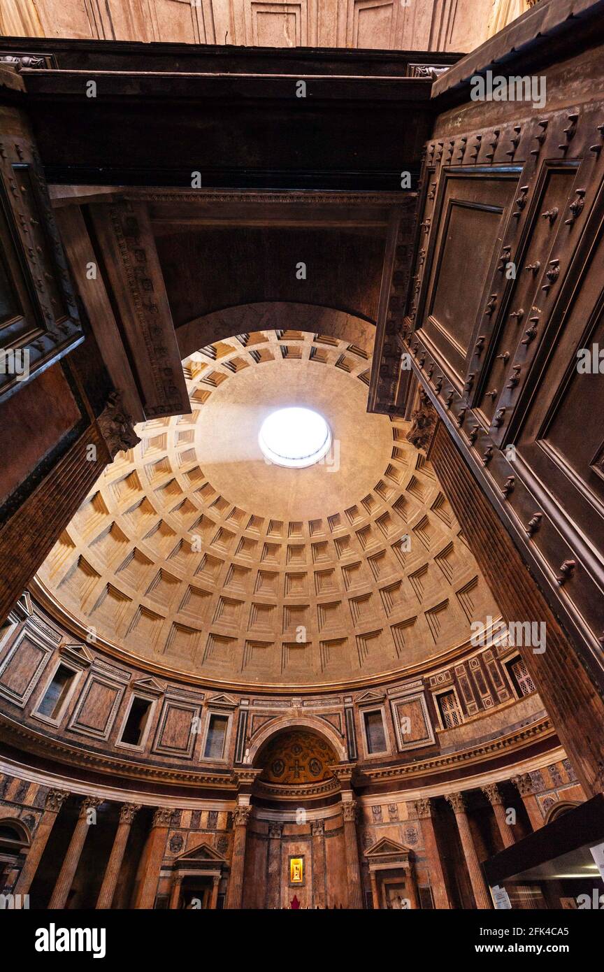 Looking into the Pantheon doorway to the oculus at the interior dome's apex Stock Photo