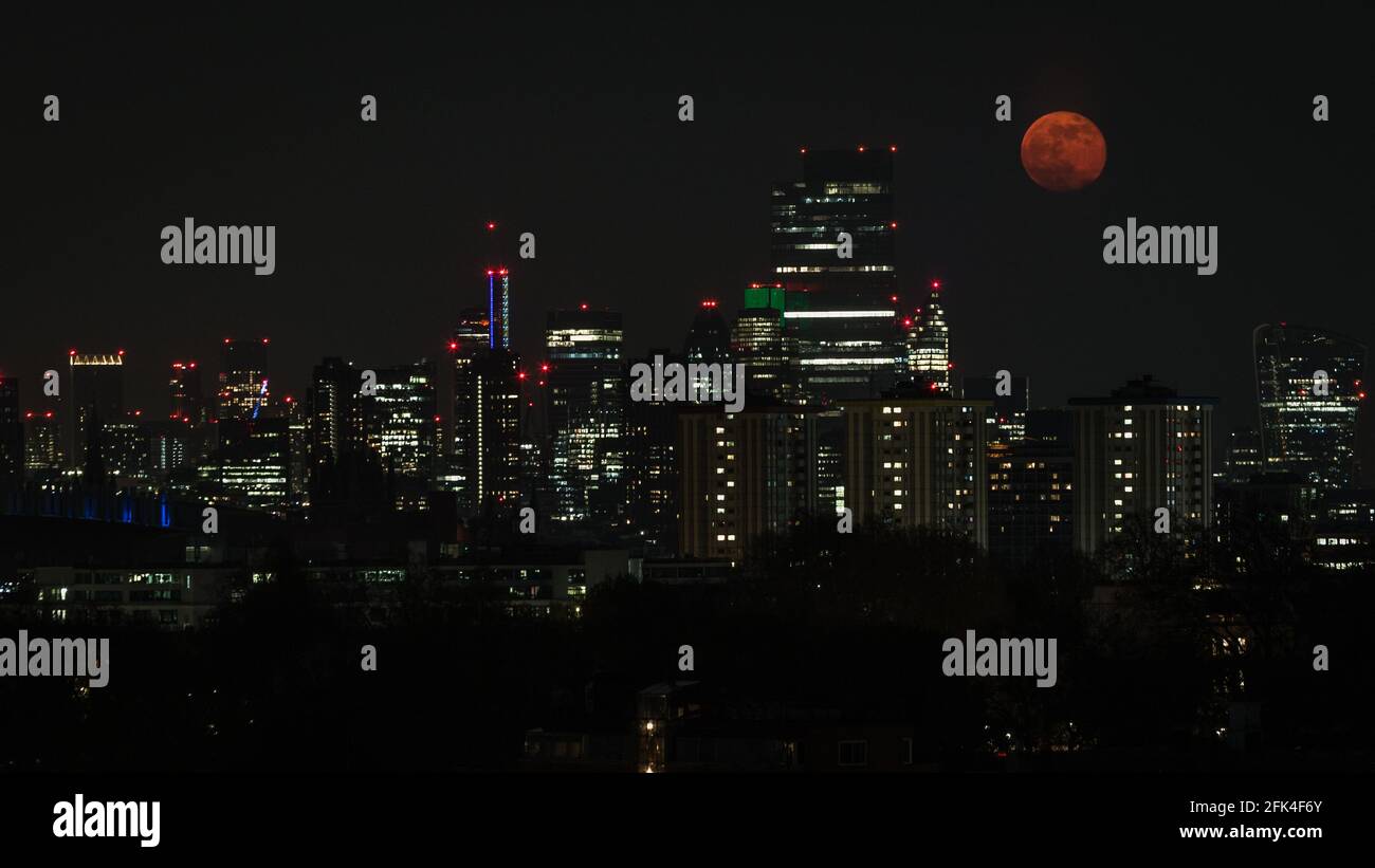 Celestial Event as the super pinkmoon rises over London. Stock Photo