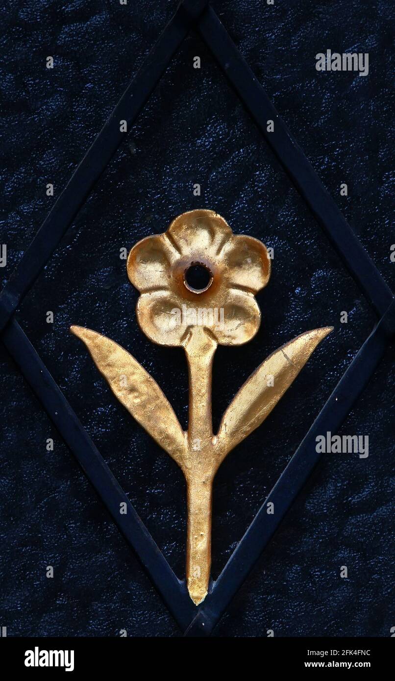 Decorative architectural element. seamless texture of iron dark blue  diamond grill with golden flower. Esslingen. Germany Stock Photo - Alamy