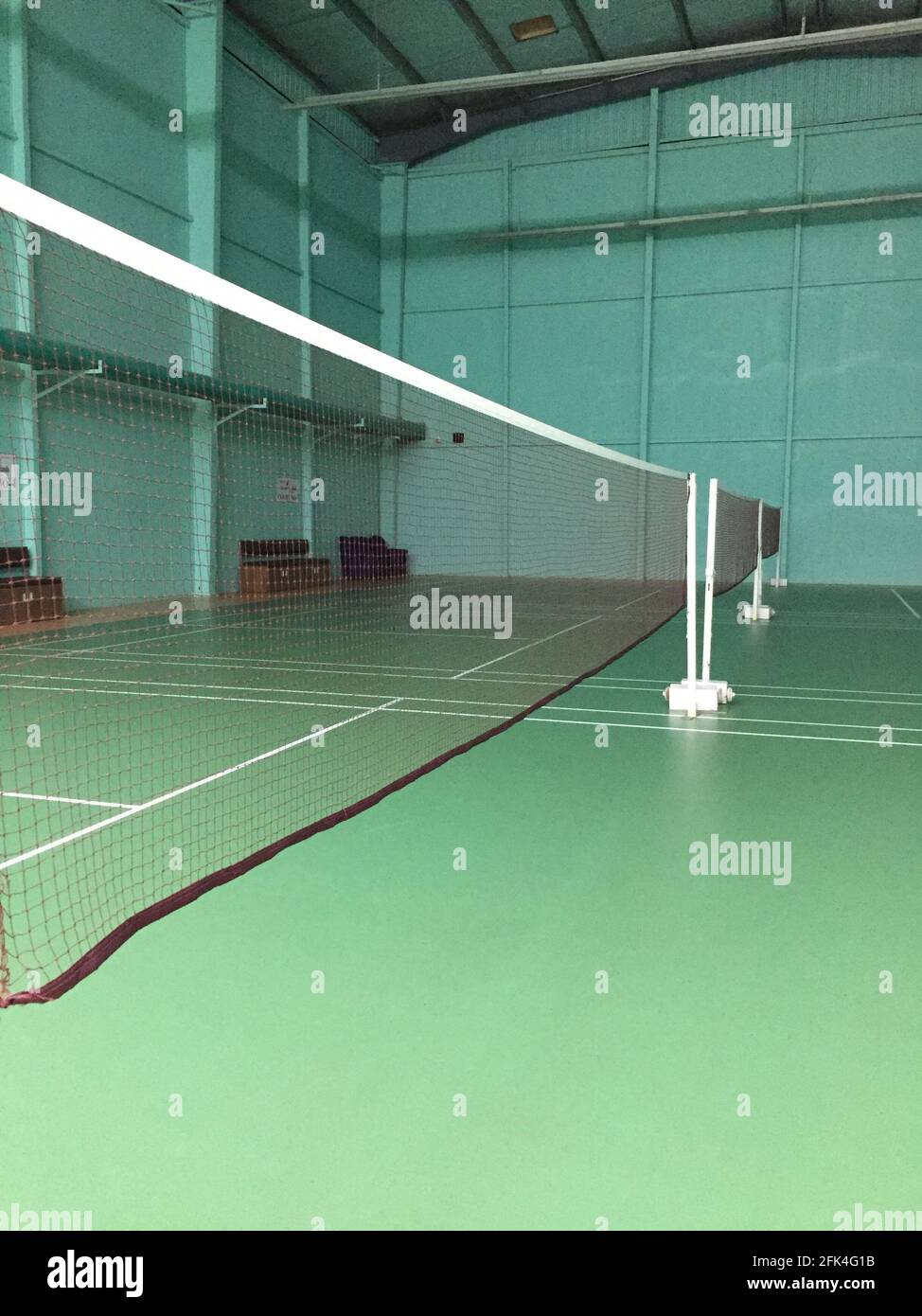 Vertical shot of an empty indoor badminton court Stock Photo Alamy